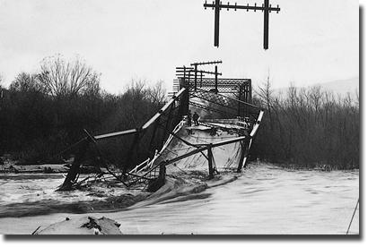 An old steel bridge over the Santa Ana River which collapsed during high flood flows on January 19, 1916.